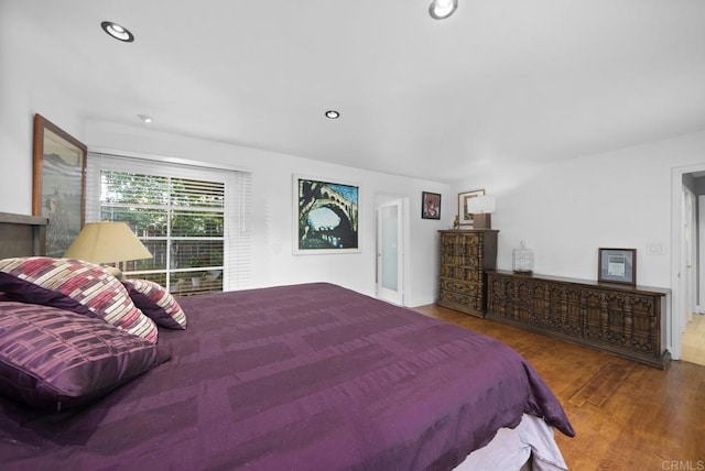 bedroom featuring recessed lighting and wood finished floors