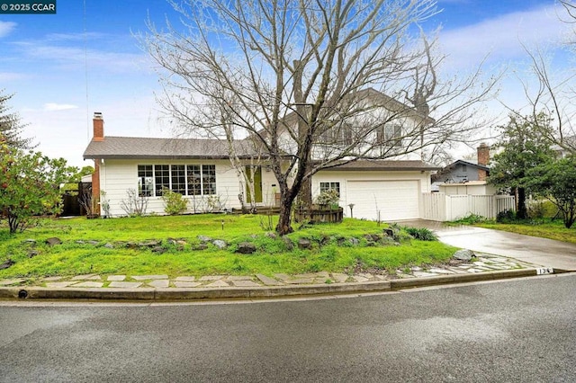 ranch-style house featuring a garage and a front lawn