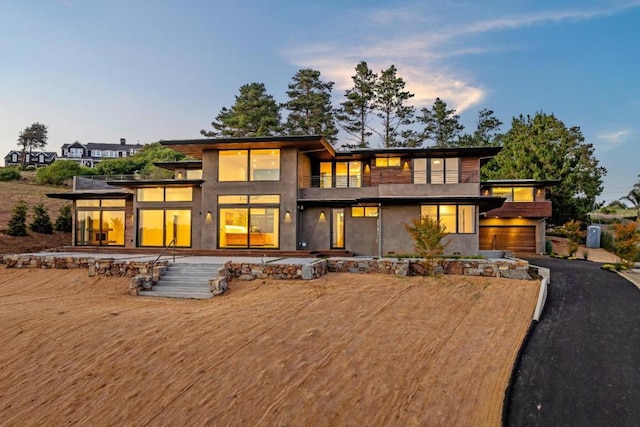 exterior space featuring a balcony and a garage