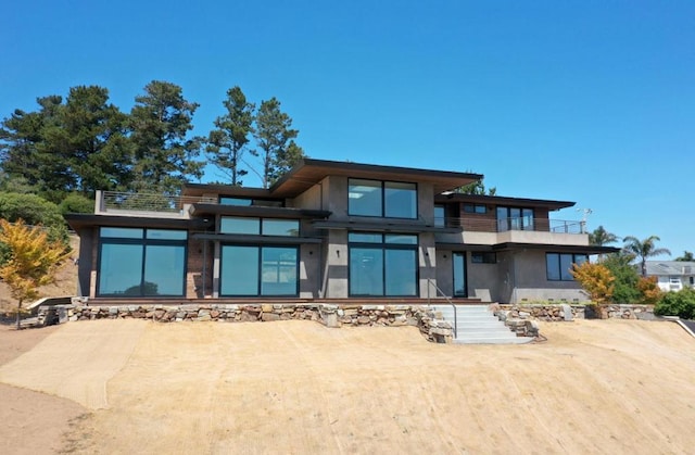 rear view of house with a balcony