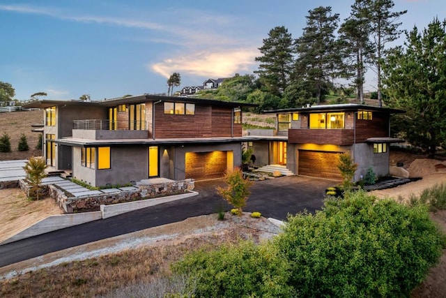 contemporary house with a balcony and a garage