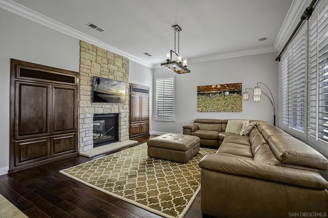 living room featuring a fireplace, crown molding, and dark wood-type flooring