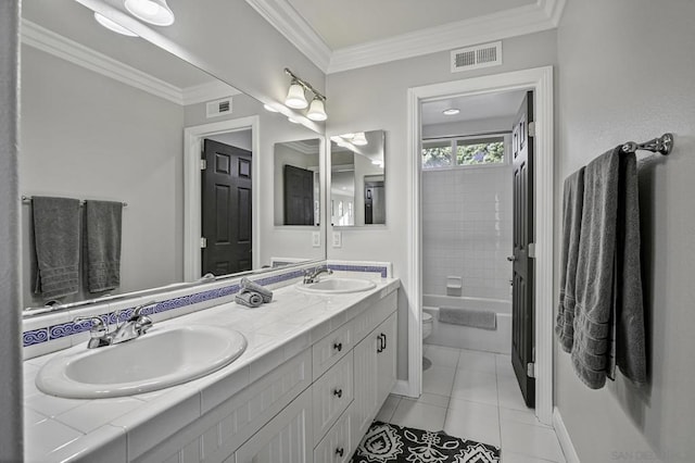 full bathroom featuring crown molding, tiled shower / bath combo, vanity, tile patterned floors, and toilet