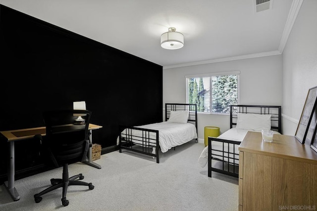 carpeted bedroom with ornamental molding