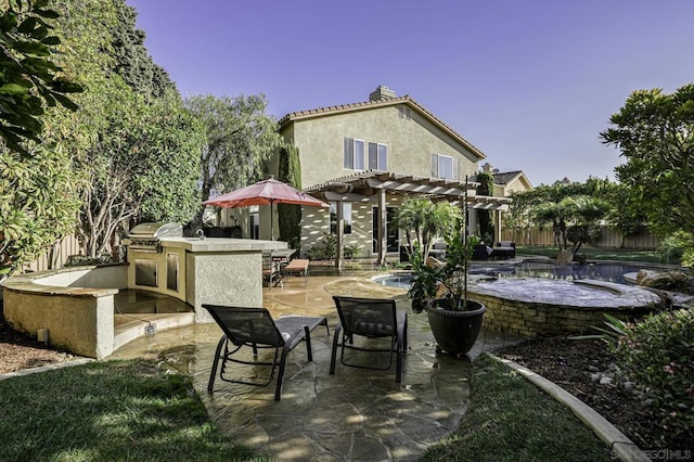 view of patio with exterior bar, area for grilling, and a pergola