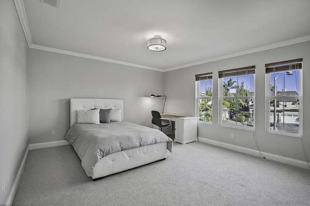 carpeted bedroom featuring ornamental molding