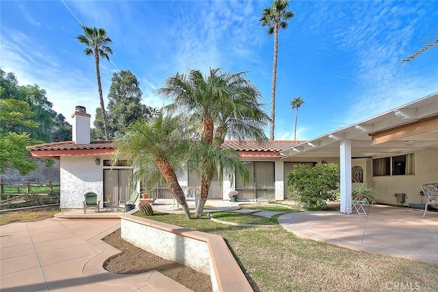 rear view of house featuring a patio area