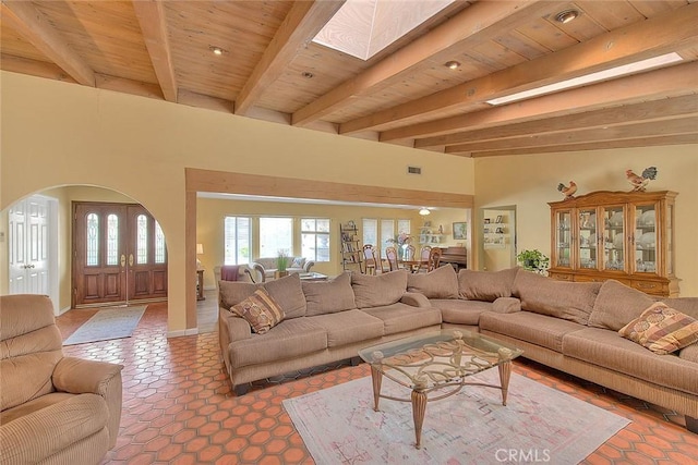 living room featuring wood ceiling and beamed ceiling