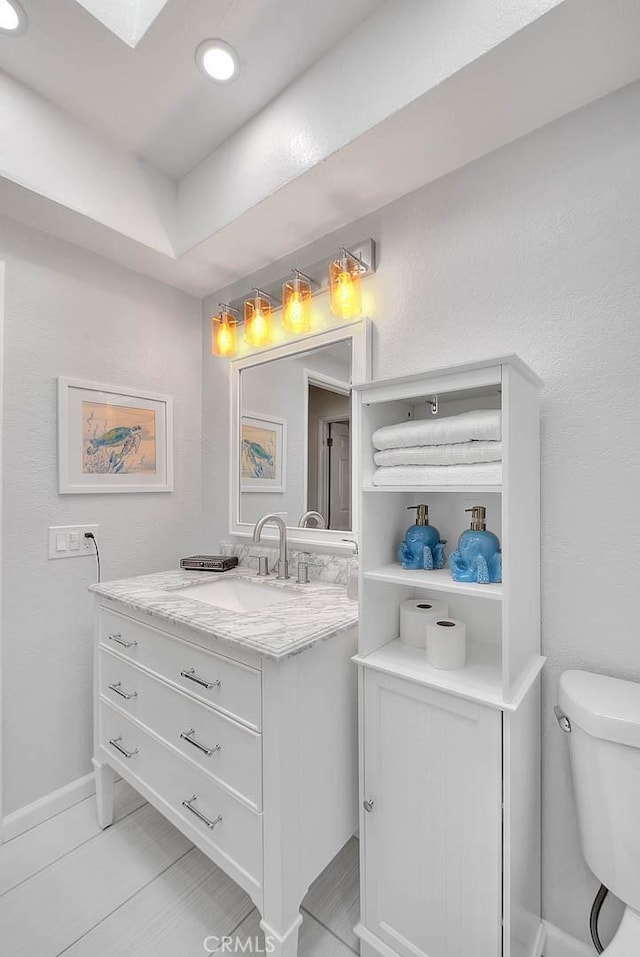 bathroom with vanity and toilet