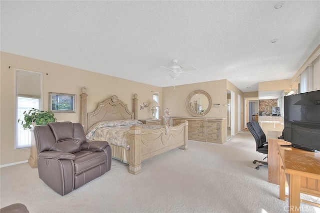 carpeted bedroom featuring connected bathroom and a textured ceiling