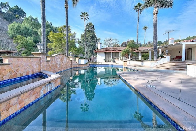 view of swimming pool with a patio area