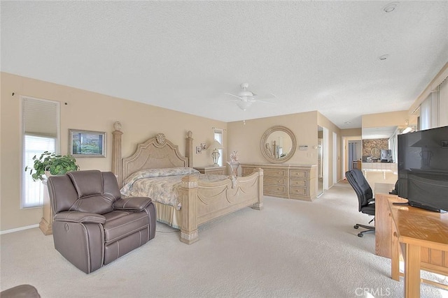 carpeted bedroom featuring ensuite bathroom and a textured ceiling