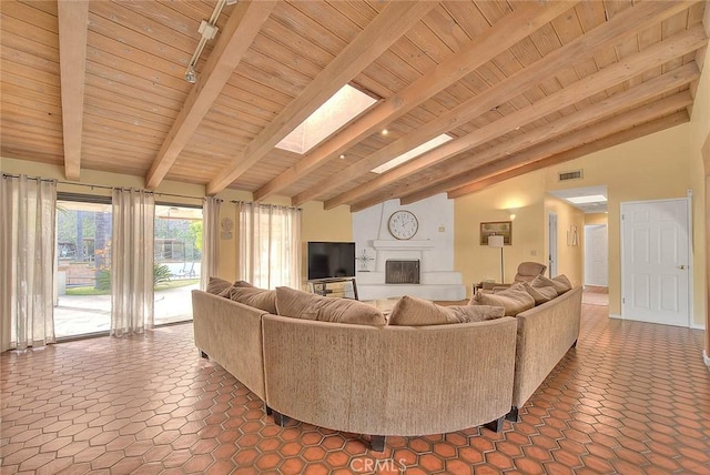 tiled living room with lofted ceiling with skylight and wood ceiling