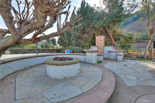 view of patio / terrace with an outdoor fire pit