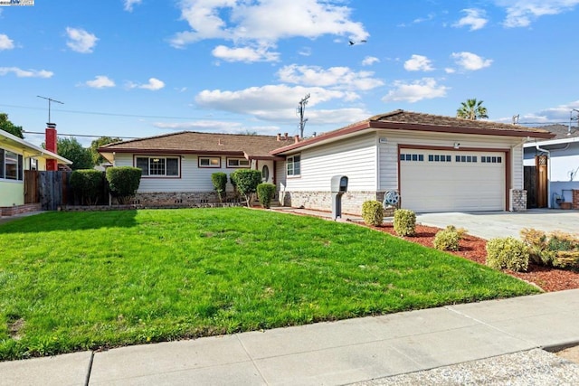 view of front of property with a garage and a front yard