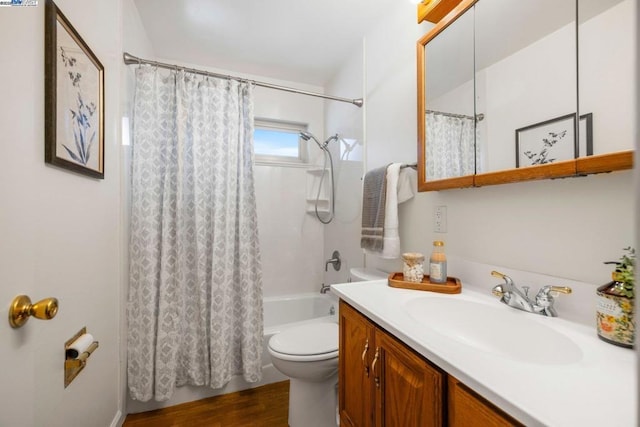 full bathroom with vanity, hardwood / wood-style flooring, shower / bath combo, and toilet