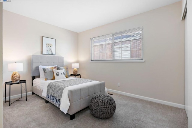 bedroom with light colored carpet