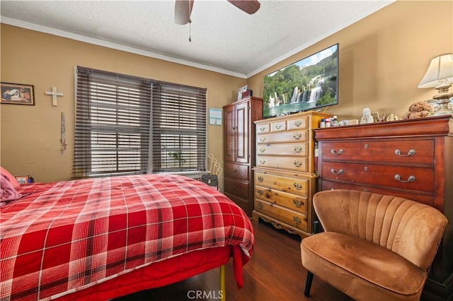 bedroom with hardwood / wood-style flooring, ceiling fan, ornamental molding, and a textured ceiling