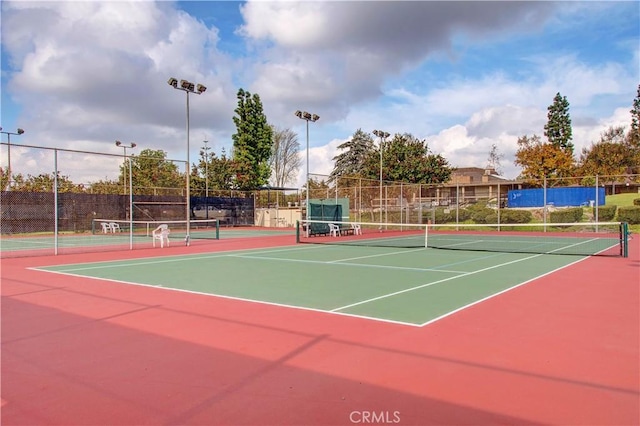 view of sport court featuring basketball hoop