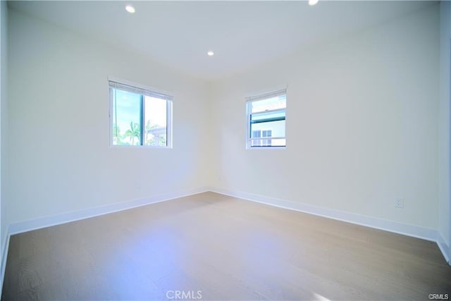 4455 S Slauson Ave, Culver City, CA 90230 - unfurnished room featuring recessed lighting, baseboards, and wood finished floors