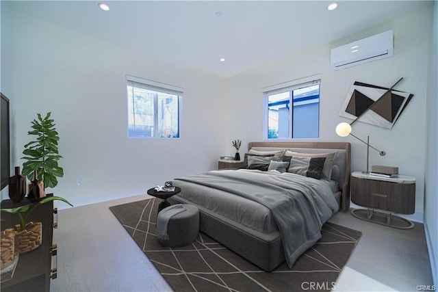 bedroom featuring an AC wall unit