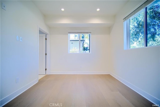 empty room featuring hardwood / wood-style flooring