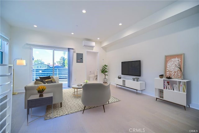 4455 S Slauson Ave, Culver City, CA 90230 - living area featuring recessed lighting, a wall unit AC, baseboards, electric panel, and wood finished floors