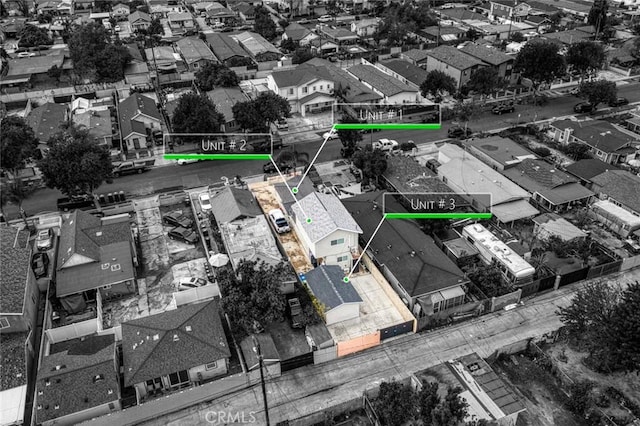 birds eye view of property with a residential view