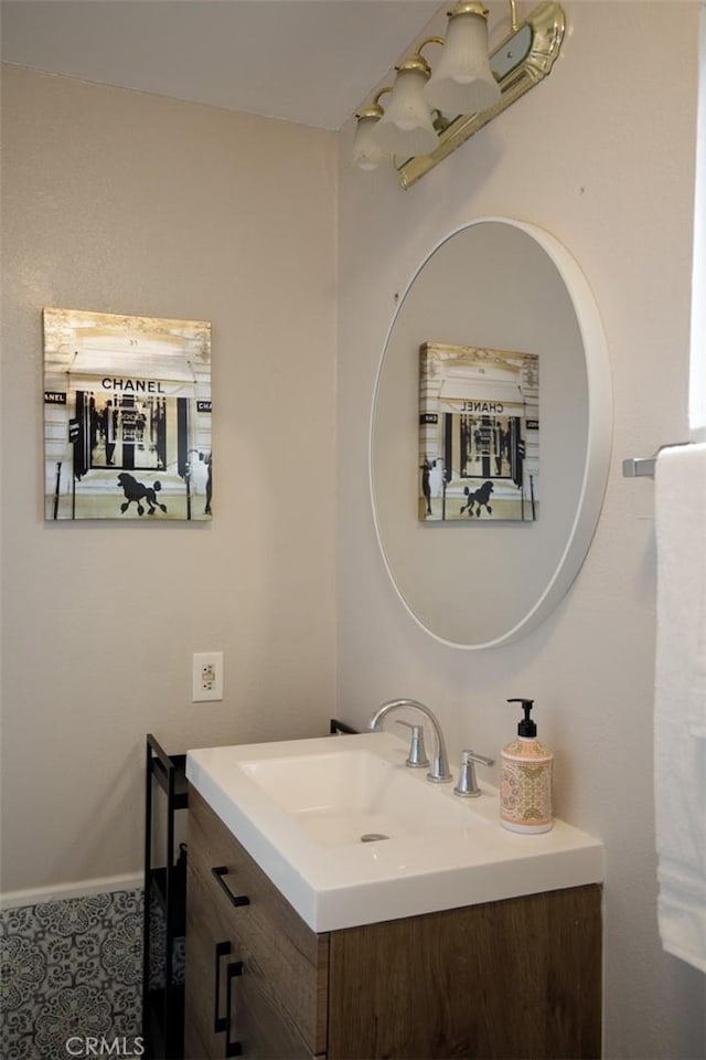 bathroom featuring vanity and baseboards