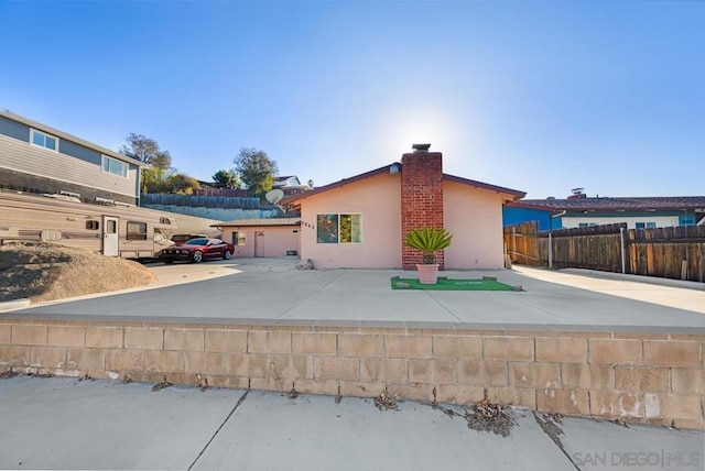 rear view of property featuring a patio