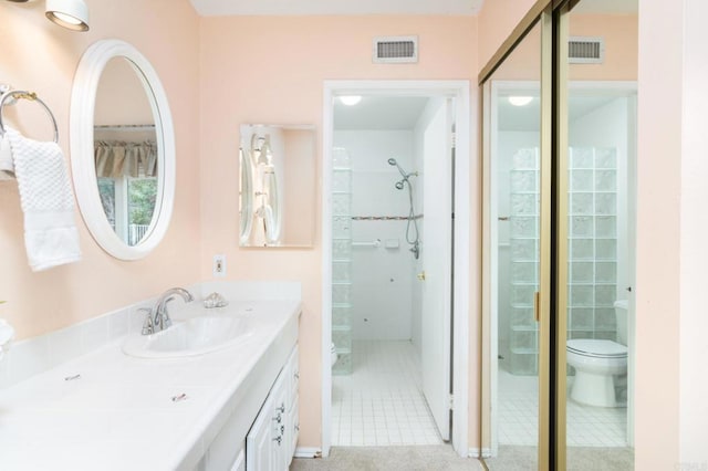 full bath with tile patterned floors, visible vents, toilet, a shower, and vanity