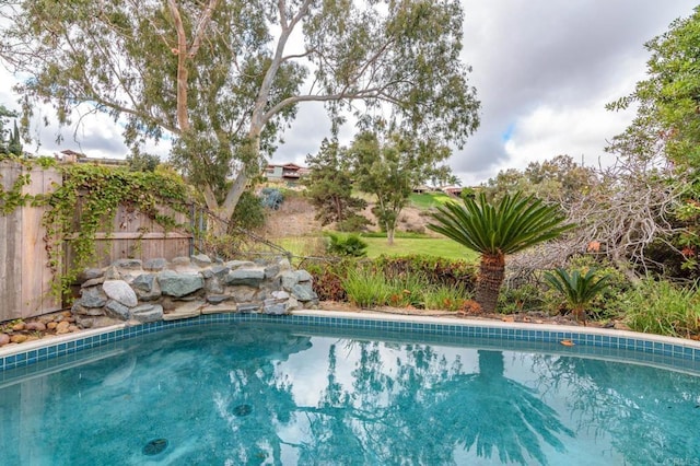 view of pool featuring a fenced in pool and fence