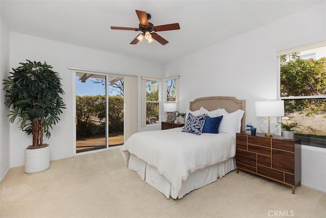 bedroom with access to outside, a ceiling fan, and light colored carpet