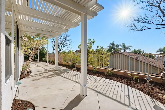 view of patio / terrace with fence and a pergola