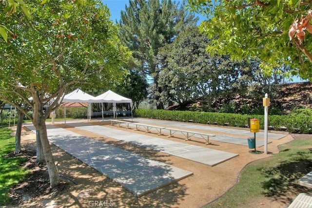 view of community with a gazebo and shuffleboard