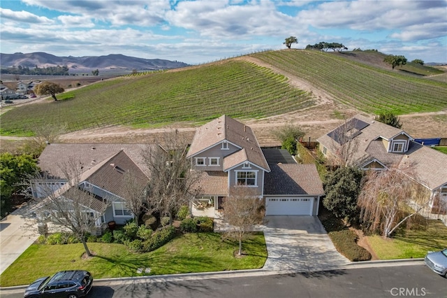 bird's eye view featuring a mountain view and a rural view