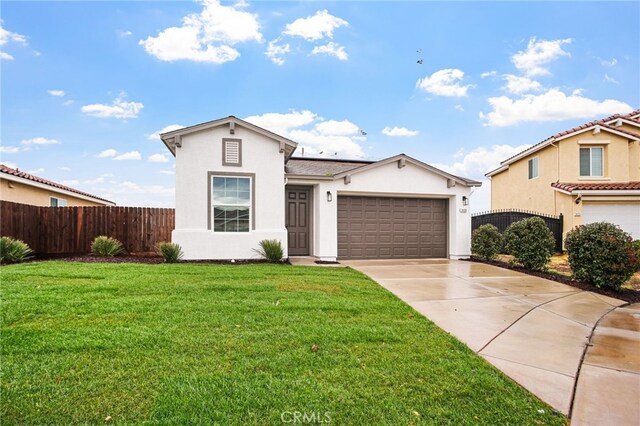 mediterranean / spanish-style house with a garage and a front lawn