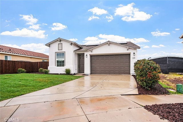 view of front of property featuring a garage and a front yard