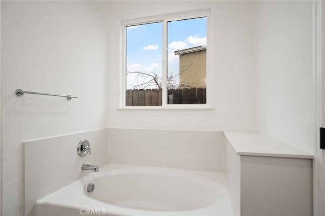 bathroom featuring a washtub