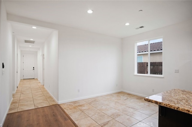 empty room with light tile patterned floors