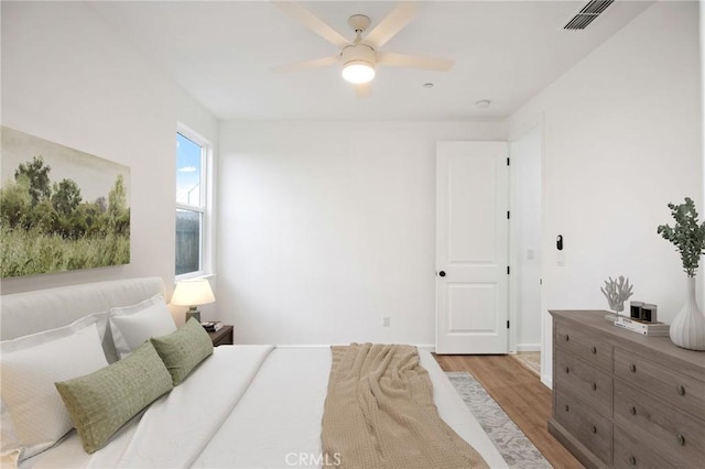 bedroom featuring hardwood / wood-style flooring and ceiling fan