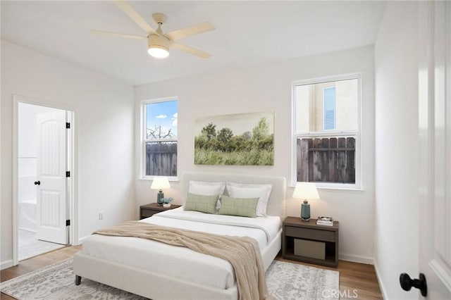 bedroom with hardwood / wood-style floors and ceiling fan