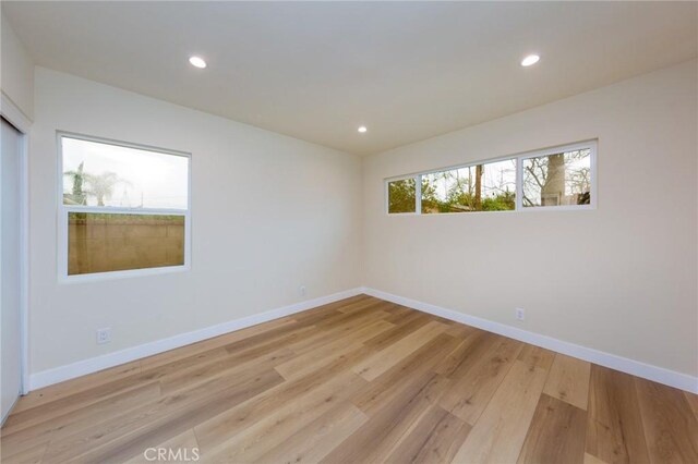 spare room featuring light hardwood / wood-style flooring