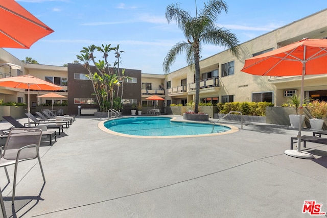 view of pool featuring a patio