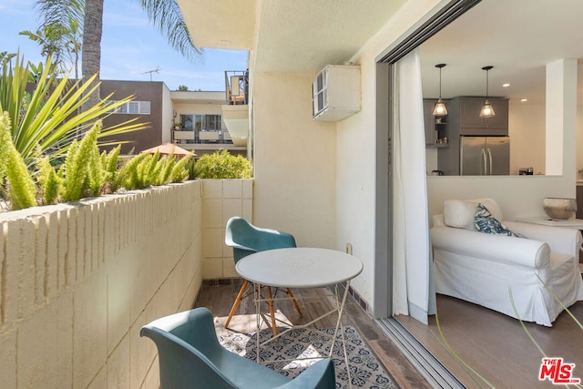 balcony featuring a wall mounted air conditioner