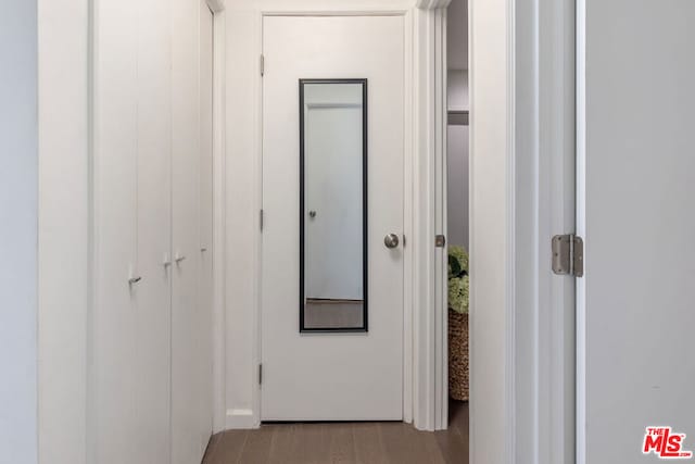 corridor with light hardwood / wood-style floors