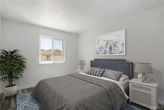 bedroom with hardwood / wood-style floors