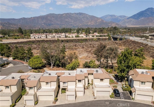 birds eye view of property featuring a mountain view