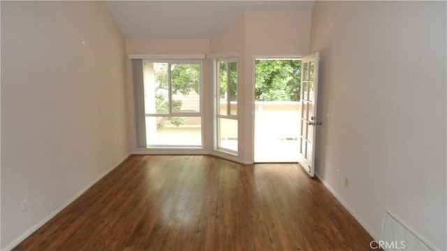 empty room featuring dark hardwood / wood-style floors