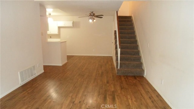 interior space featuring dark hardwood / wood-style floors and ceiling fan